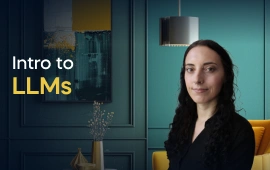 The Intro to LLMs course creator stands in a modern office setting with the text 'Intro to LLMs' on the left side of the image.