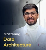 The Introduction to Data Architecture course creator stands in a modern office setting with the text 'Introduction to Data Architecture' on the left side of the image.