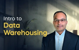 The Introduction to Data Warehousing course creator stands in a modern office setting with the text 'Introduction to Data Warehousing' on the left side of the image.