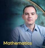 The Mathematics course creator stands in a modern office setting with the text 'Mathematics' on the left side of the image.