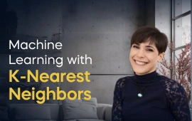 The Machine Learning with K-Nearest Neighbors course creator stands in a modern office setting with the text 'Machine Learning with K-Nearest Neighbors' on the left side of the image.